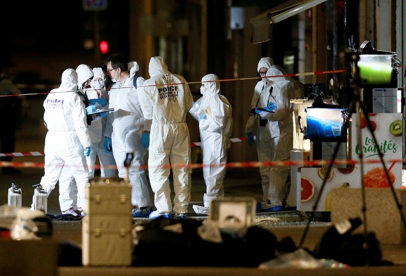 FILE PHOTO: Forensic officers inspect the site of a suspected bomb attack in central Lyon