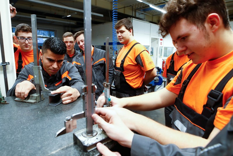 Afghan refugee Hotak takes part in a qualification and integration program for migrants at Ford Motor Co in Cologne