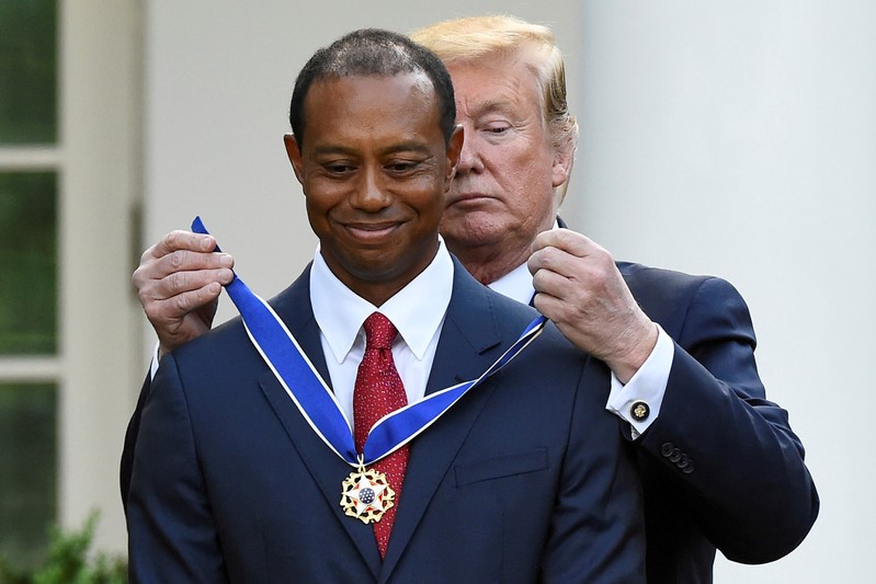 FILE PHOTO: Golfer Tiger Woods is awarded the Presidential Medal of Freedom at the White House in Washington