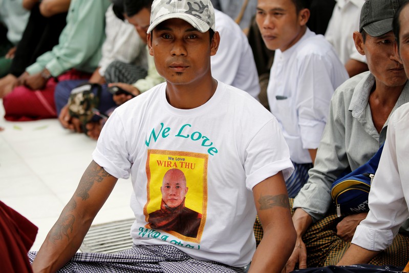A supporter of a hard-line Buddhist monk Wirathu is seen at Shwedagon Pagoda in Yangon, following monk's arrest warrant on a charge of sedition in Yangon