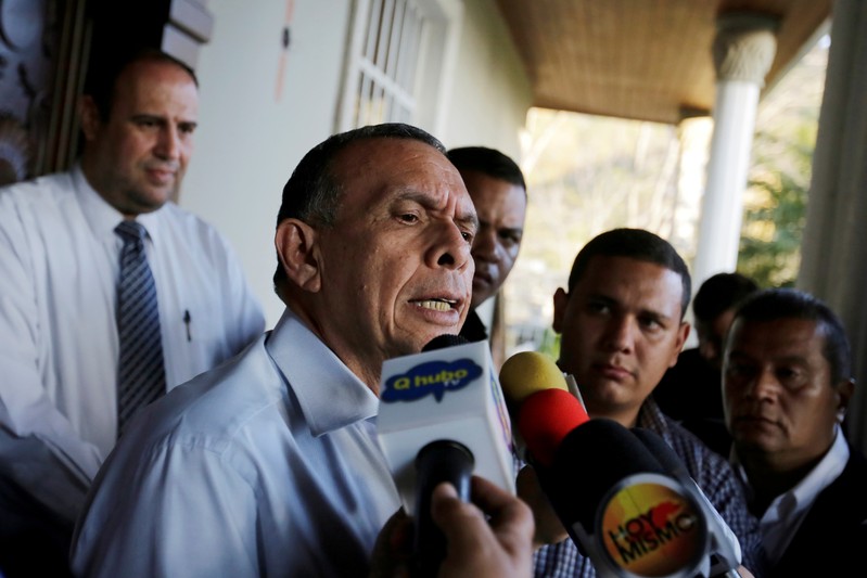 FILE PHOTO: Former Honduran president Porfirio Lobo holds a news conference at his house following accusations by the National Anti-corruption Council of embezzlement during his government, in Tegucigalpa