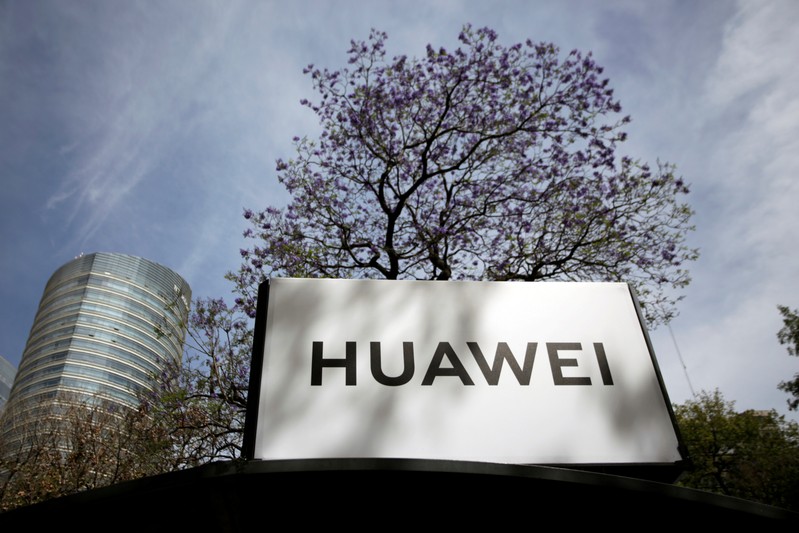 FILE PHOTO: The Huawei logo is seen at a bus stop in Mexico City