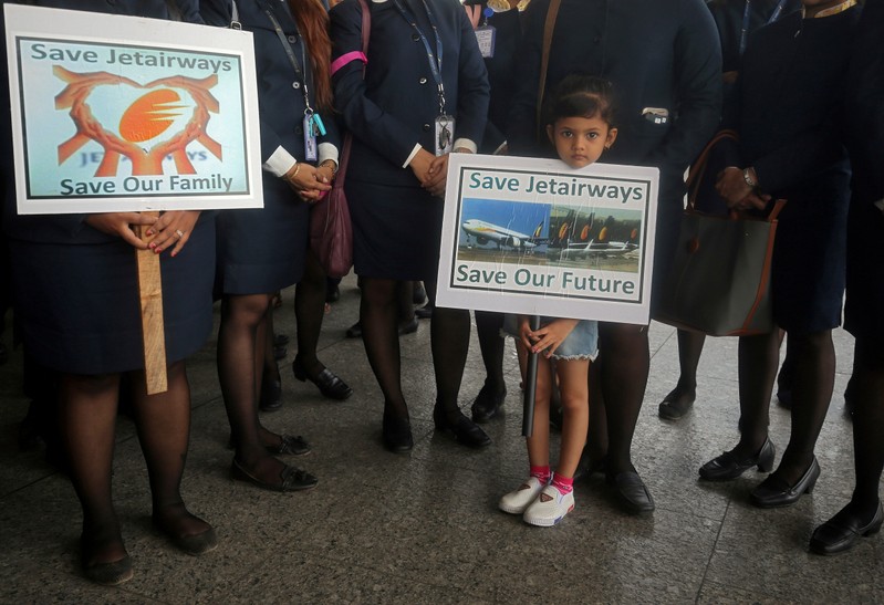 FILE PHOTO: Keren Rodriguez, daughter of a Jet Airways employee, holds a placard as she attends a protest by Jet Airways employees demanding to 