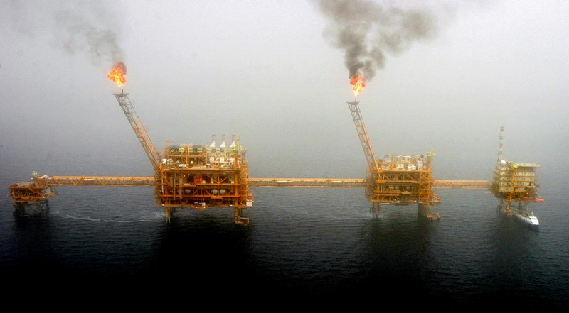 FILE PHOTO: Gas flares from an oil production platform are seen at the Soroush oil fields.