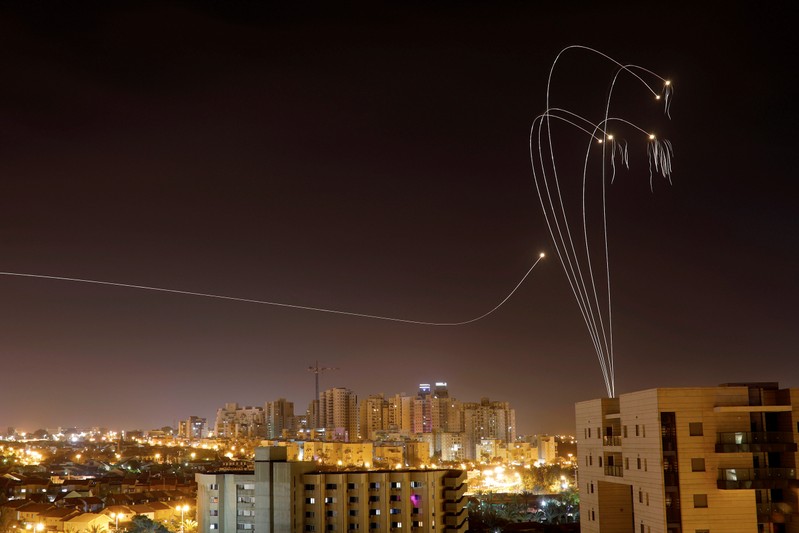 Iron Dome anti-missile system fires interception missiles as rockets are launched from Gaza towards Israel as seen from the city of Ashkelon, Israel