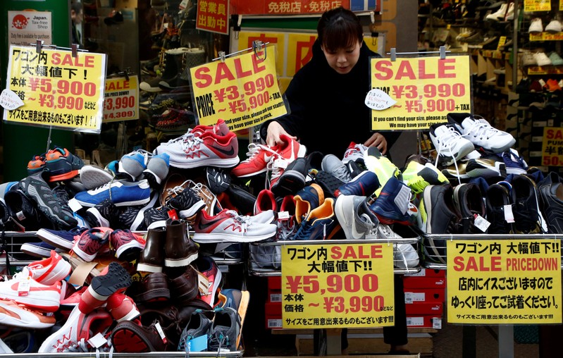 FILE PHOTO: A clerk arranges shoes at a shop in Tokyo