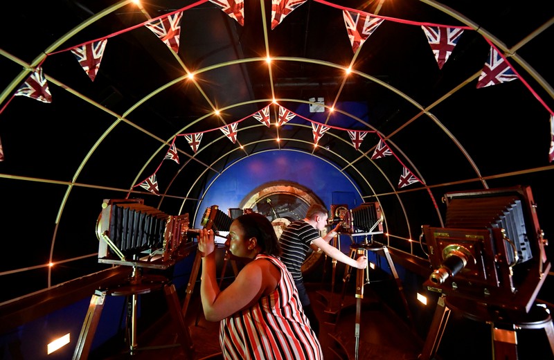 Visitors pose as they view 'Jeff Wayne's The War of The Worlds: The Immersive Experience' attraction, based on the book by HG Wells, in London, Britain