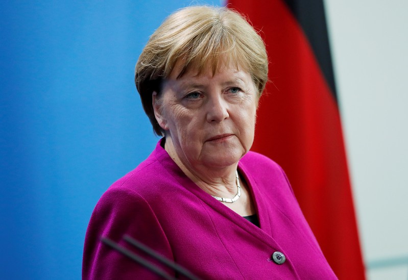FILE PHOTO: German Chancellor Merkel looks on as she attends a news conference at the Chancellery in Berlin