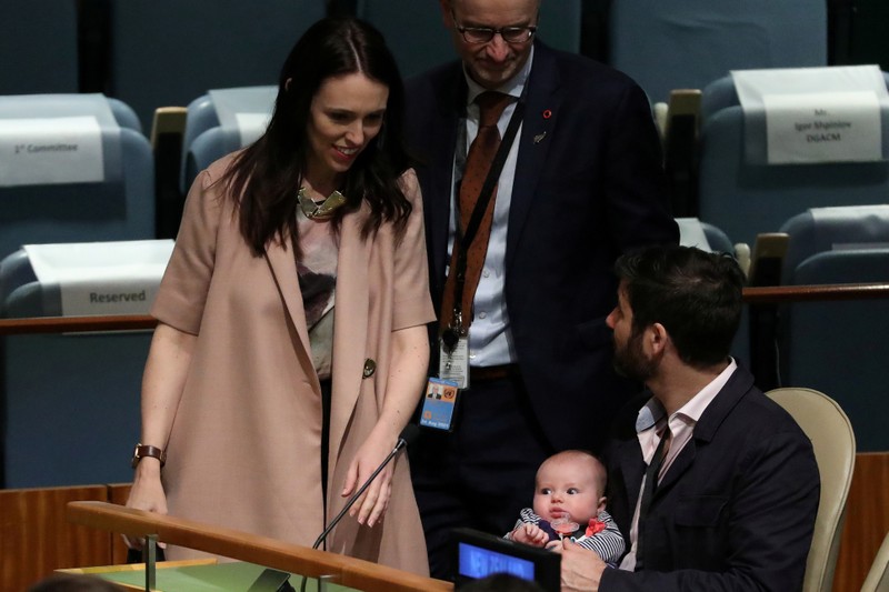 FILE PHOTO: New Zealand Prime Minister Jacinda Ardern walks back to her baby Neve and partner Clarke Gayford, after speaking at the Nelson Mandela Peace Summit during the 73rd United Nations General Assembly in New York City