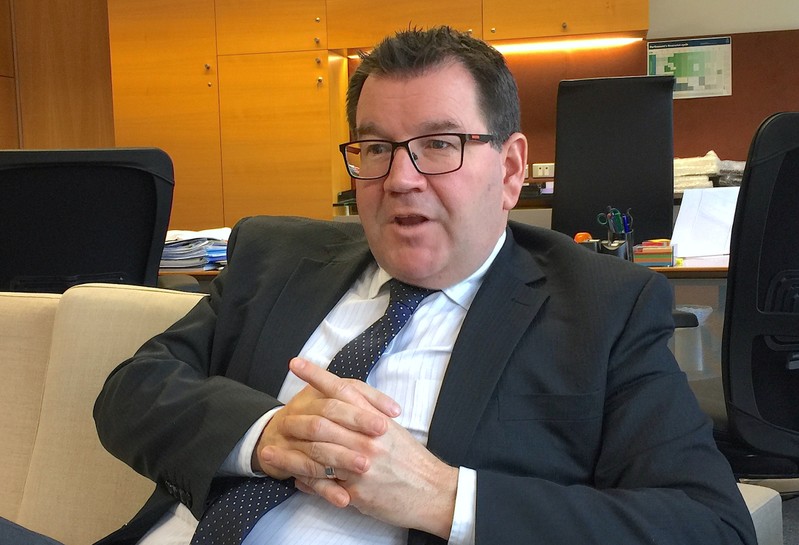 New Zealand's Finance Minister Grant Robertson reacts during an interview in his office in Wellington