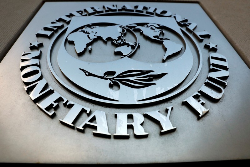 FILE PHOTO: FILE PHOTO: The IMF logo is seen outside the headquarters building in Washington
