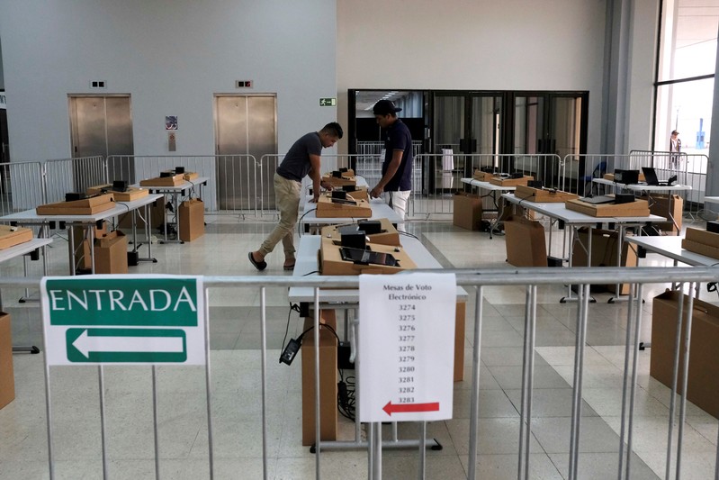 Technicians install digital polling stations for a simulation to learn how to use the digital vote during the preparations for the upcoming general election in Panama City