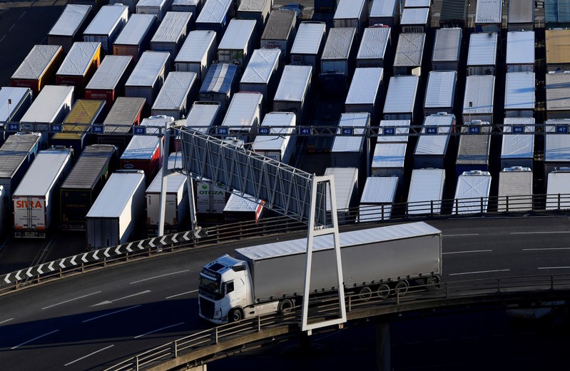 FILE PHOTO: A lorry is driven past dozens of others parked after travelling by ferry between Britain and France at the Port of Dover