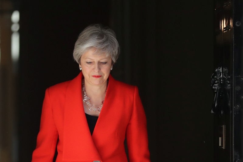 British Prime Minister Theresa May arrives to deliver a statement in London