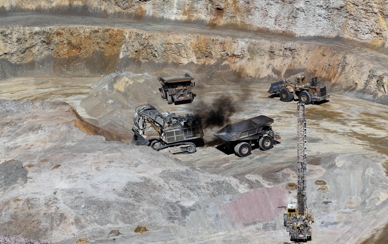 FILE PHOTO: Dump trucks and bulldozers operate at Barrick Gold Corp's Veladero gold mine in Argentina's San Juan province