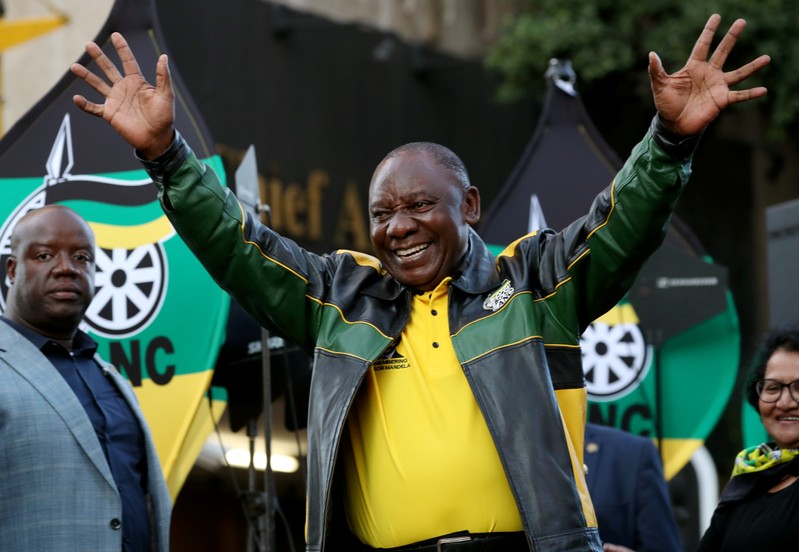 FILE PHOTO: President Cyril Ramaphosa waves to supporters of his ruling African National Congress (ANC) at an election victory rally in Johannesburg