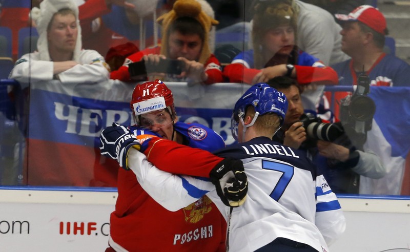 Russia's Malkin scuffles with Finland's Esa Lindell during their Ice Hockey World Championship game at the CEZ arena in Ostrava