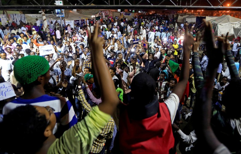 FILE PHOTO: Sudanese protesters attend a demonstration along the streets of Khartoum