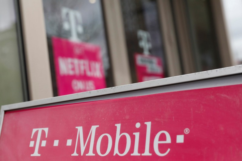 A sign for a T-Mobile store is seen in Manhattan, New York