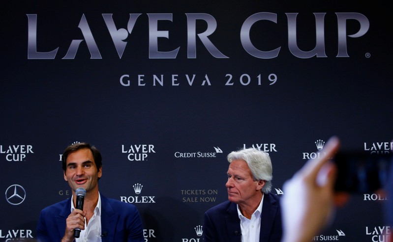 Borg of Sweden sits beside as Switzerland's Federer addresses a news conference to promote the Laver Cup tennis tournament in Geneva