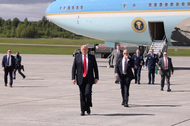 U.S. President Trump arrives aboard Air Force One during a refueling stop on his way to Japan at Joint Base Elmendorf, Alaska