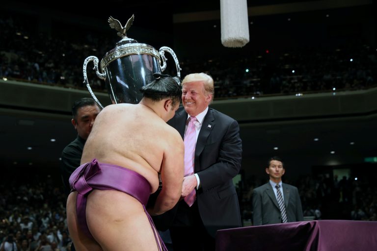 Trump presented a sumo wrestler with an American-made, eagle-topped trophy during his Japan trip