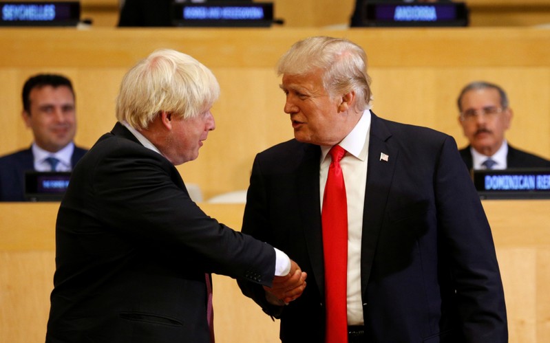 FILE PHOTO - U.S. President Donald Trump shakes hands with British Foreign Secretary Boris Johnson as they take part in a session on reforming the United Nations at U.N. Headquarters in New York