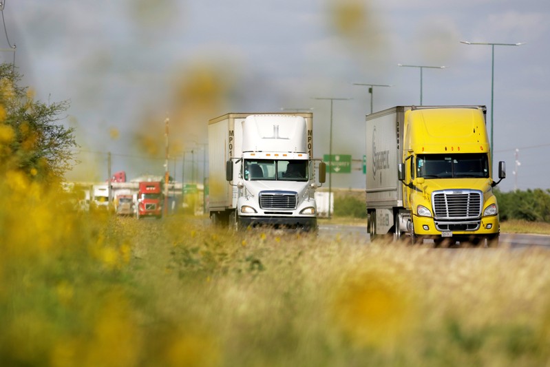 Trucks are seen before arriving at a border customs control to cross into U.S. at the World Trade Bridge in Nuevo Laredo