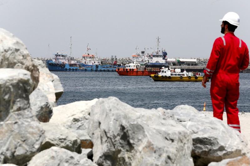 A technical staff is seen at the Port of Fujairah