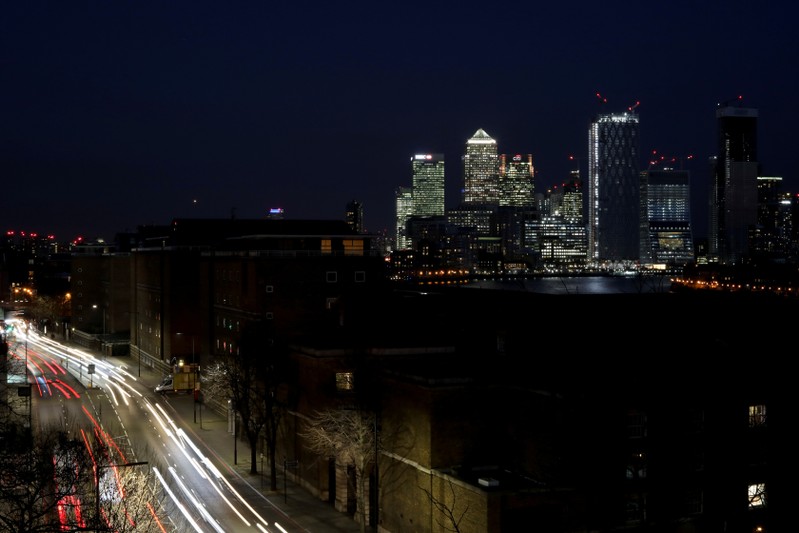 FILE PHOTO: The Canary Wharf financial district is seen at dusk in London