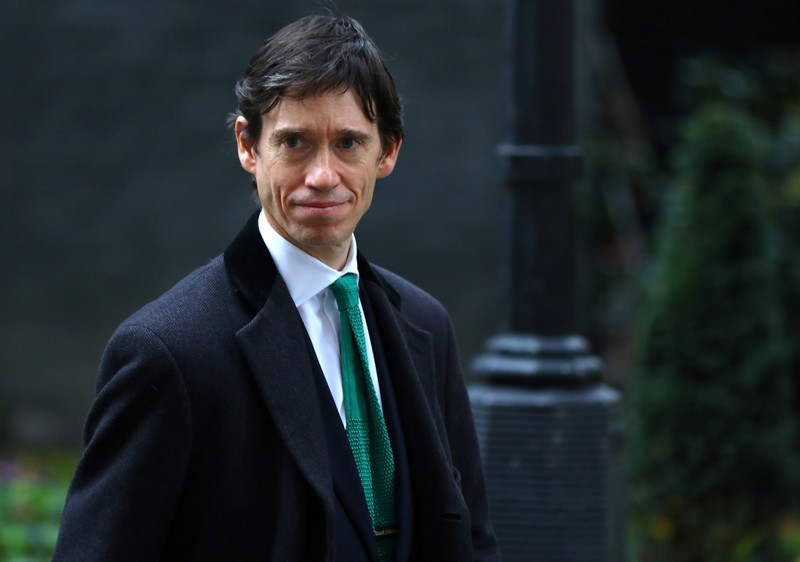 FILE PHOTO - Rory Stewart, Britain's Minister for Prisons, walks through Downing Street in London