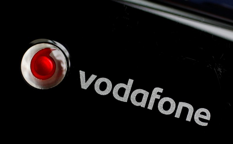 FILE PHOTO: A Vodafone logo is seen on a mobile internet dongle in this photo illustration