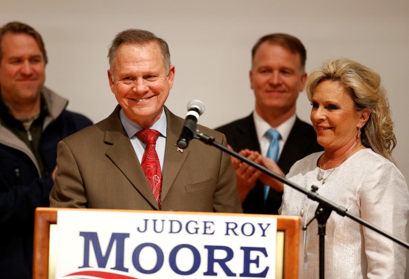 FILE PHOTO: Republican U.S. Senate candidate Roy Moore addresses supporters as his wife Kayla looks on at his election night party in Montgomery