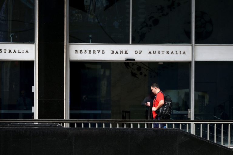 Australia’s central bank cuts rates to record lows as growth sags