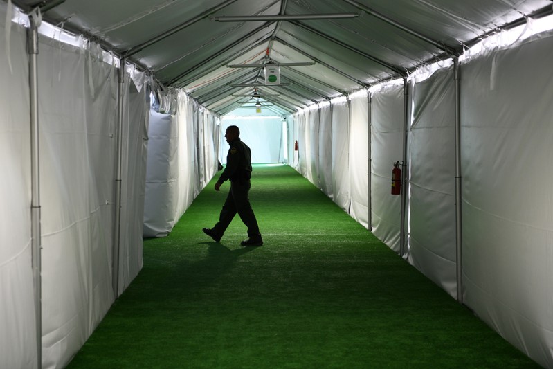 A U.S. Border Patrol agent is seen during a tour of U.S. Customs and Border Protection (CBP) temporary facilities in Donna