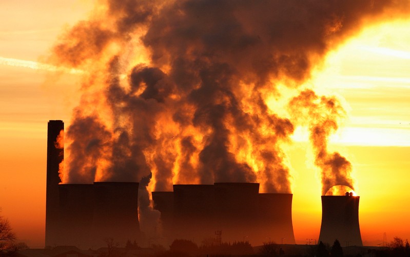 FILE PHOTO: The sun rises behind Fiddlers Ferry coal fired power station near Liverpool