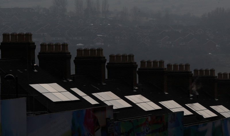 FILE PHOTO: Solar panels on refurbished homes reflect the sun in Stoke-on-Trent,