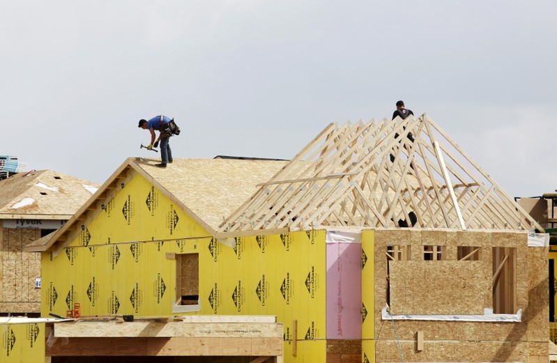 Construction workers build a new house in Calgary