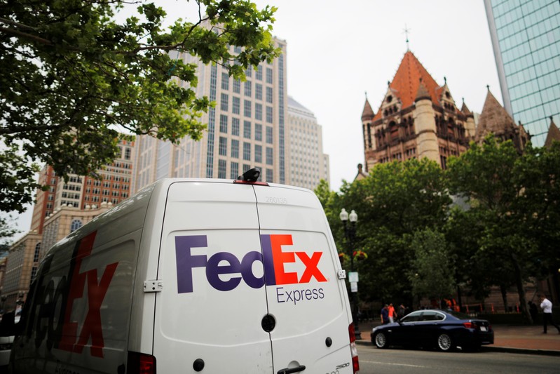 A Fedex truck makes deliveries and pick-ups in the Back Bay in Boston