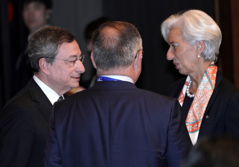 International Monetary Fund (IMF) Managing Director Christine Lagarde and European Central Bank (ECB) President Mario Draghi speak prior to the G20 finance ministers and central bank governors meeting, in Fukuoka