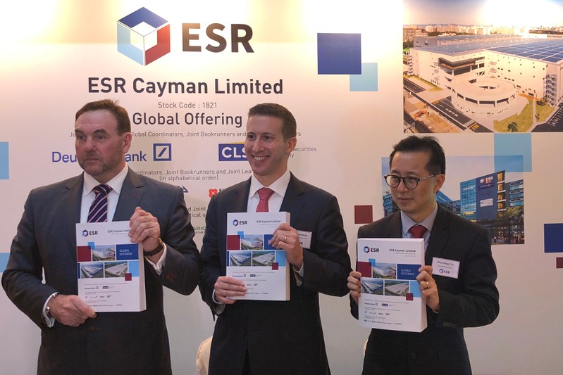 Co-CEO Stuart Gibson, Chairman Jeffrey Perlman and CFO Wee Peng Cho of the logistics real estate developer ESR Cayman Ltd attend a news conference on the company's IPO in Hong Kong