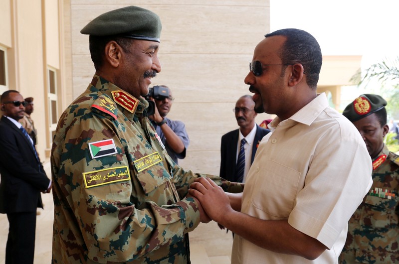 Ethiopian Prime Minister Abiy Ahmed meets Sudan's Head Of Transitional Military Council, Lieutenant General Abdel Fattah Al-Burhan Abdelrahman to mediate in the political crisis at the airport in Khartoum