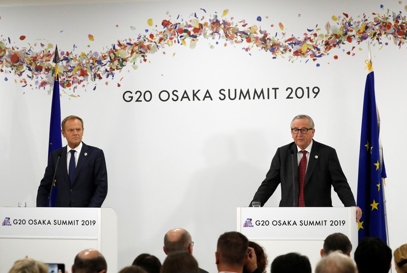 European Commission President Jean-Claude Juncker and European Council President Donald Tusk attend a news conference at the G20 leaders summit in Osaka