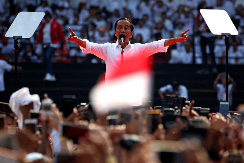 FILE PHOTO: Indonesia's incumbent presidential candidate Joko Widodo gestures as he speaks during a campaign rally at Gelora Bung Karno stadium in Jakarta