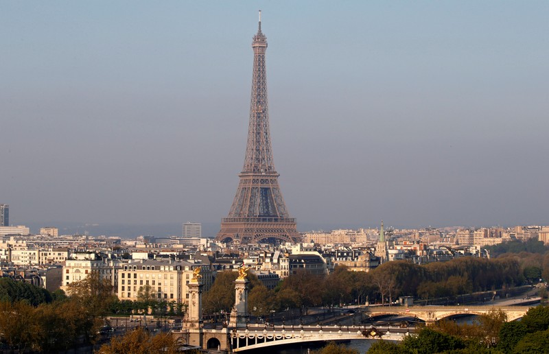 FILE PHOTO: General view of the Eiffel tower behind the Seine river in Paris