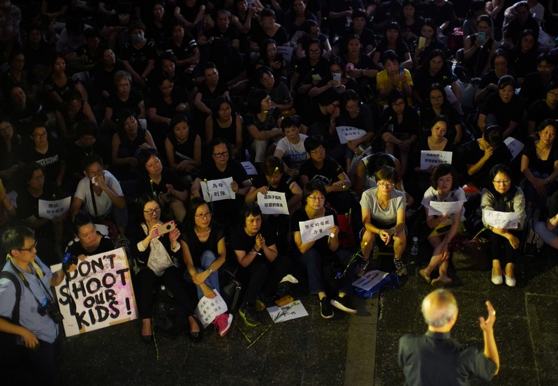 People attend a rally in support of demonstrators protesting against proposed extradition bill with China, in Hong Kong