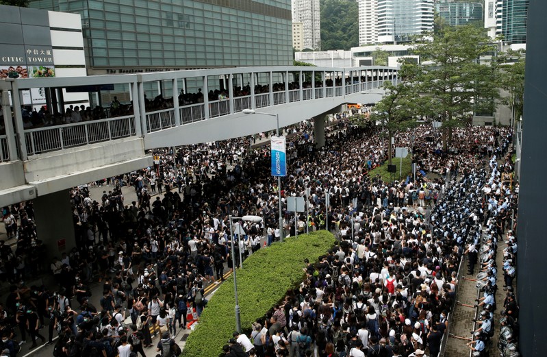 Protesters gather outside the entrance to the Legislative Council building in Hong Kong