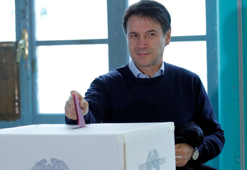 Italian Prime Minister Giuseppe Conte casts his vote at a polling station in Rome