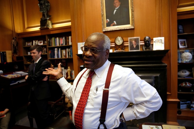 FILE PHOTO: U.S. Supreme Court Justice Thomas talks in his chambers at the U.S. Supreme Court building in Washington