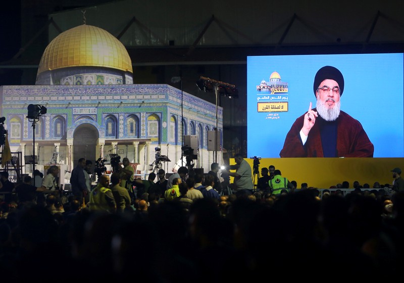 Lebanon's Hezbollah leader Sayyed Hassan Nasrallah addresses his supporters via a screen during a rally marking al-Quds Day, (Jerusalem Day) in Beirut